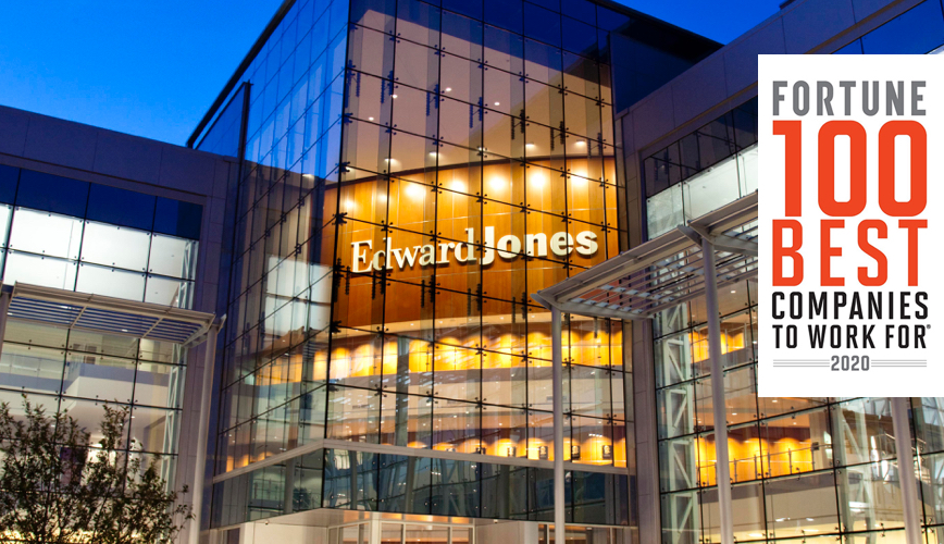 Exterior shot of an Edward Jones glass building at night.